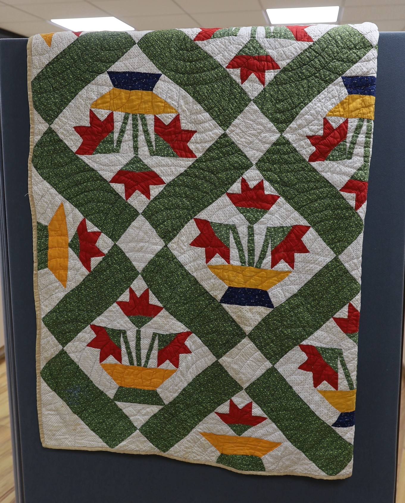 An American style multi coloured patchwork quilted cover, -170 cms long x 168 wide.